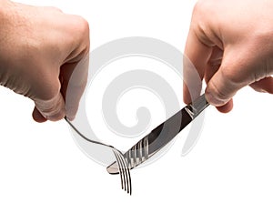 Hands holding empty fork and knife
