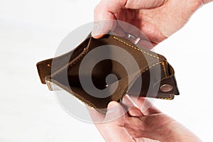 Hands holding an empty wallet. Bankruptcy - Business Person holding an empty wallet