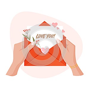 Hands holding envelope with hearts and text Love you