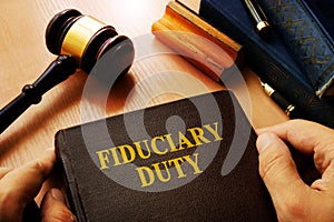 Hands holding Fiduciary duty.