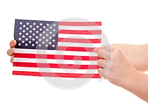 Hands holding flag of the USA