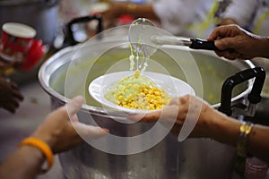 Hands holding food: Hunger problems are assisted by people in society