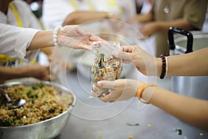 Hands holding food: Hunger problems are assisted by people in society