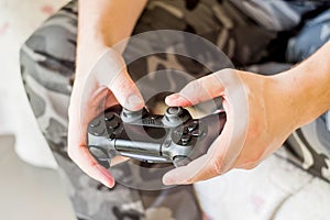 Man hands holding game controller