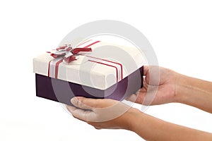 Hands holding a gift box