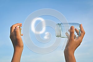 Hands holding glass jar for keeping fresh air