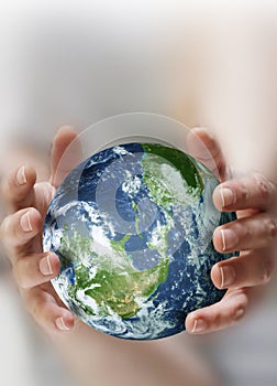 Hands holding a globe