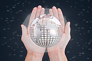 Hands holding a globe with connectors