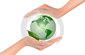 Hands holding a green earth