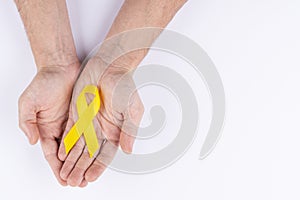 Hands holding green ribbon. White background