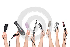 Hands holding hairdressing tools