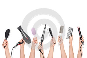Hands holding hairdressing tools photo
