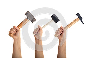 Hands holding hammers on white background