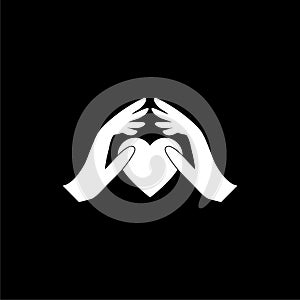 Hands holding heart icon isolated on black background