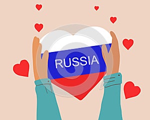 Hands holding a heart in the shape of the Russian flag. Support of the people. Resolution of the conflict. Let there be peace and