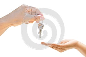 Hands holding house key giving other in hand. on white background, Mortgage loan approval home loan, and insurance concept