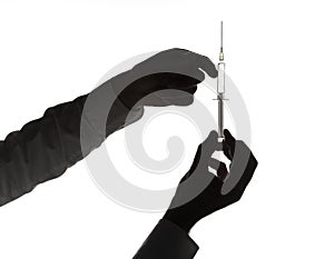 Hands holding hypodermic