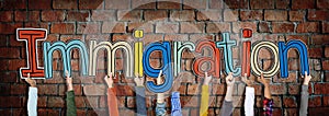 Hands Holding Immigration Word Concept