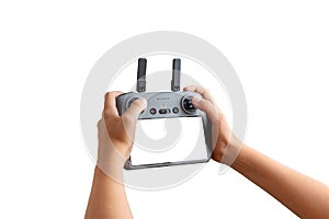 Hands holding an isolated drone controller with blank screen on white background, perfect for inserting custom UI or drone