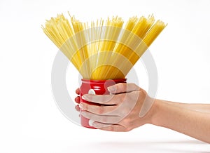 Hands holding jar with spaghetti