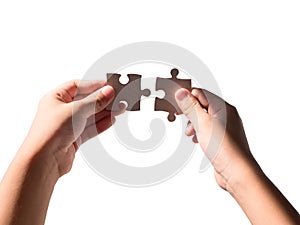 Hands holding jigsaws