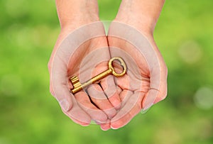 Hands holding a key