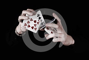 Hands holding a lot of play cards
