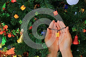 Hands holding magic gift from Christmas decorative. Merry Christmas and Happy New Year concept