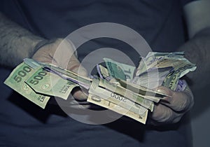 Hands holding money