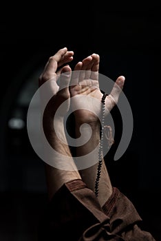 Hands Holding A Muslim Rosary