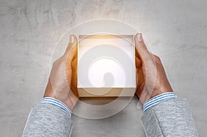 Hands holding open empty box