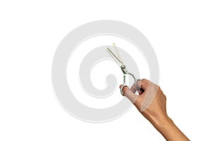 Hands holding pair of open stylish professional barber thinning scissors isolated on white background. Copy space. Top view. Flat