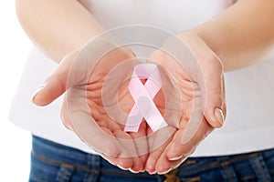 Hands holding pink breast cancer awareness ribbon