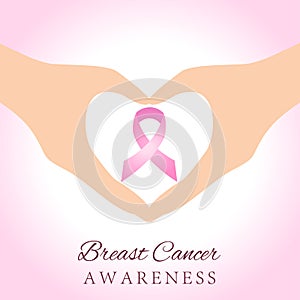 Hands holding pink breast cancer awareness ribbon