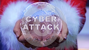 Hands holding planet with text Cyber attack