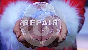 Hands holding planet with text Repair