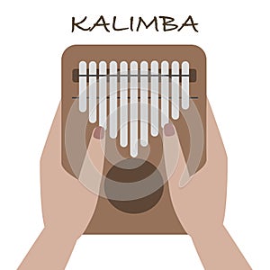 Hands holding and play Kalimba  Mbira or thumb piano