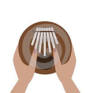 Hands holding and play Kalimba  Mbira or thumb piano