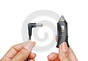 Hands holding Plug socket in car 12 volt to charging for etc. isolated on white background