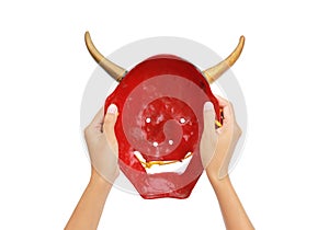 Hands holding red Kabuki Mask on white background