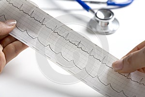 Hands holding a regular ecg