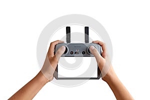 Hands holding a remote drone controller with empty screen, ideal for inserting custom UI, drone app mockups, or interface concepts