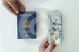 Hands holding russian passport and us dollar bills. passport issuance. Issuing bank loan. bribery at border