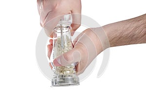 Hands holding salt mill