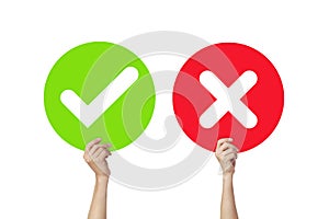 Hands holding signboard Green check mark and Red X mark or True and False signs