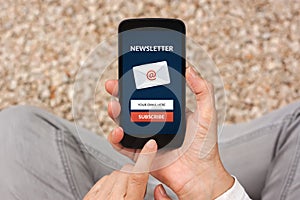 Hands holding smart phone with subscribe newsletter concept on s