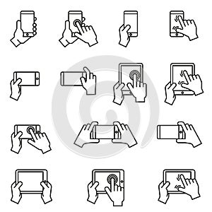 Hands holding smartphone and tablet icon set. Thin line style stock vector.