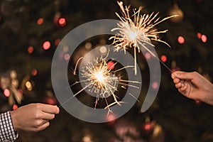 Hands holding sparklers