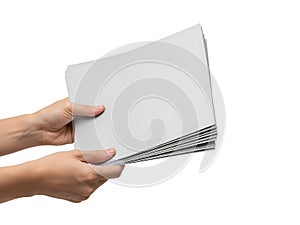 Hands holding a stack of blank white paper sheets