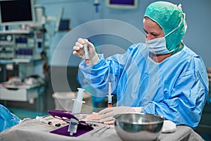 Hands Holding Syringe and Transfer Fat with Nano Fat Transfer Tool in Operation Room